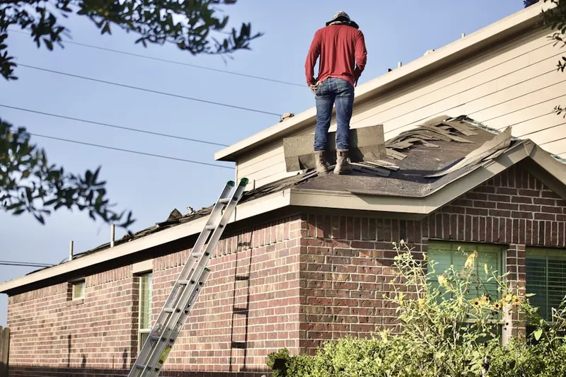 Professional roofer working on a residential roof in Sawgrass Mills